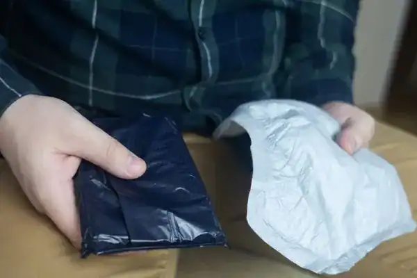 image of man holding stool incontinence Norwich products